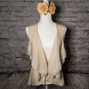 Beige lace vest.